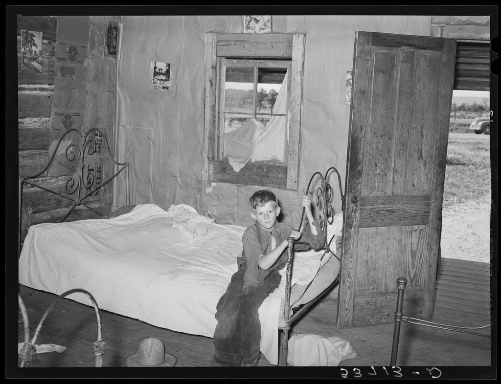 A guest room with two beds and a window