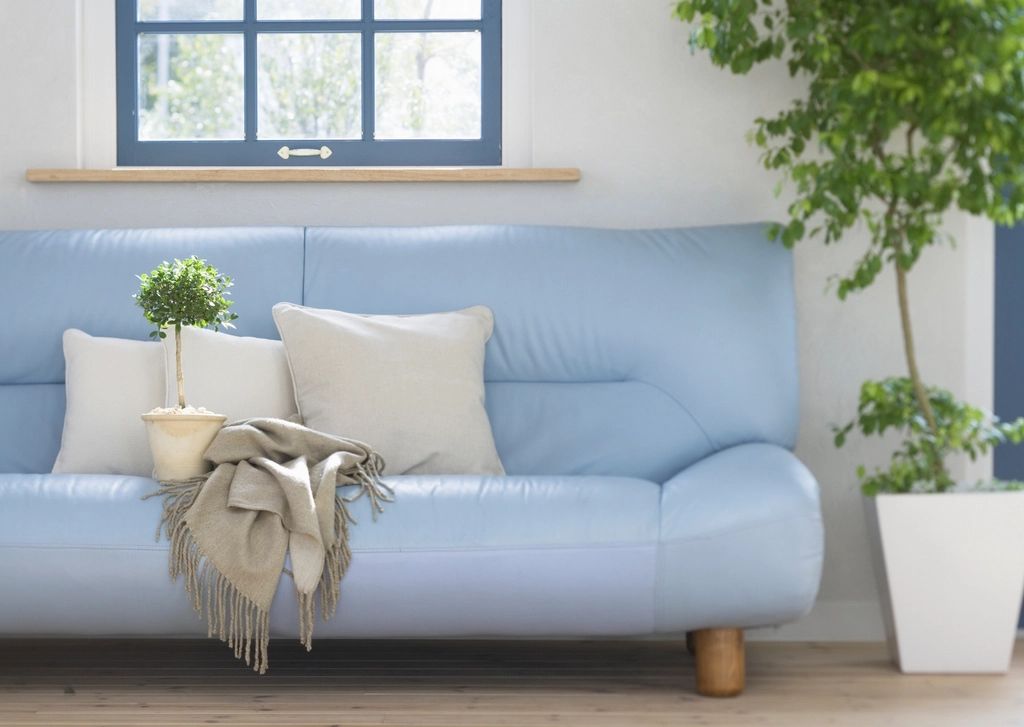 A suite sitting room with a sofa and armchairs